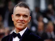 Robbie Williams Breaks UK Chart Record Held by The Beatles for Decades