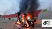 Libyan football fans set GNU building on fire in protest