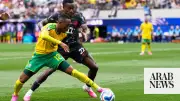Canada beats South Africa 1-0 to reach World Cup last 16 for first time