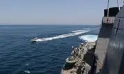 Iran Fires Warning Missiles and Drones at US Warships in Gulf of Oman